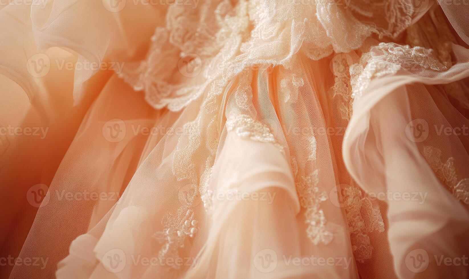 A dress with a lace design is shown in a light pink color photo