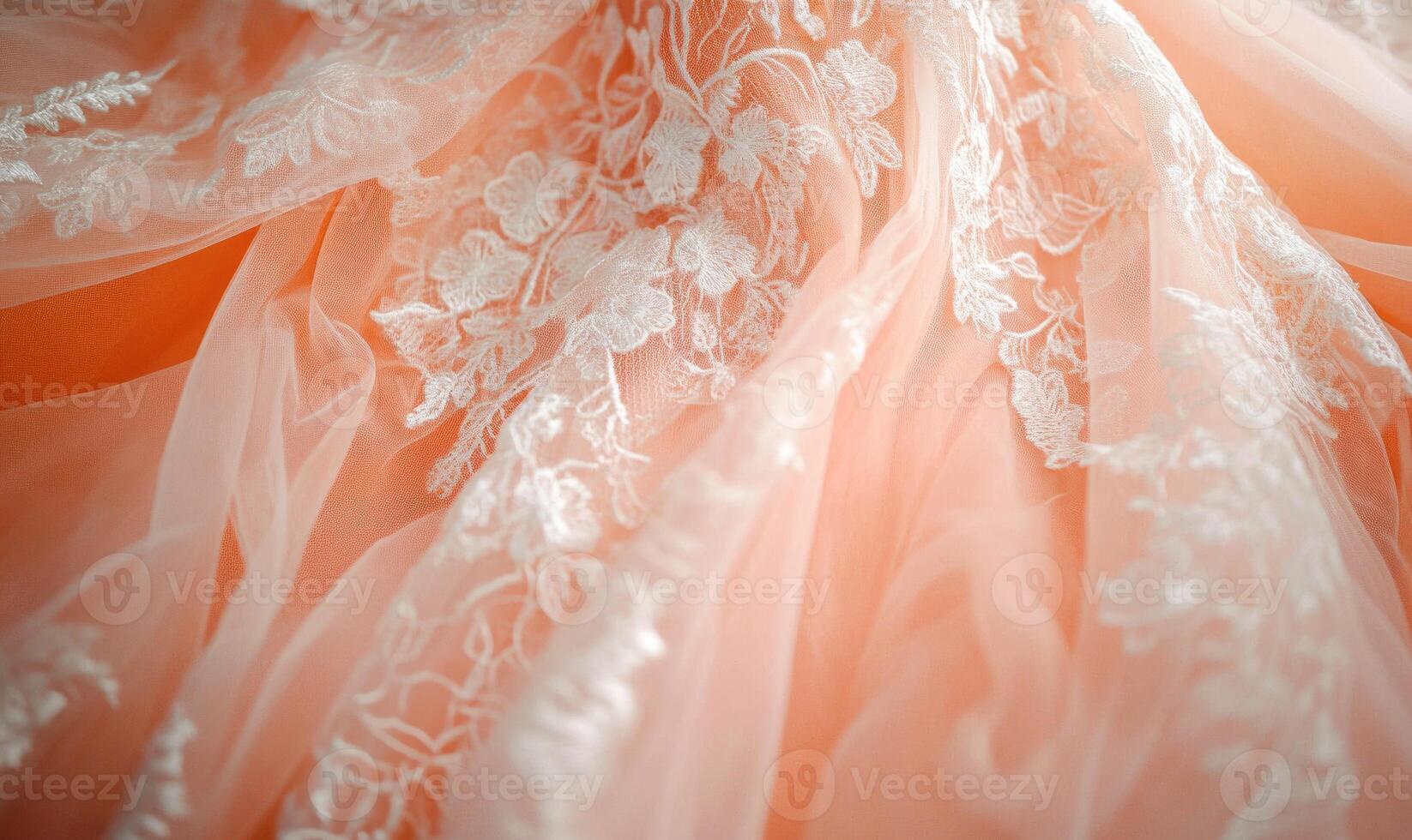 A pink and white lace fabric with flowers on it photo