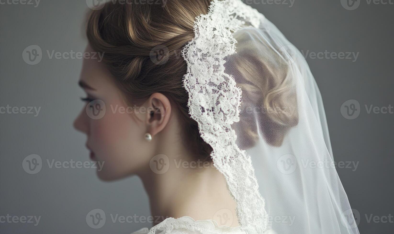 A woman with a lace veil on her head photo
