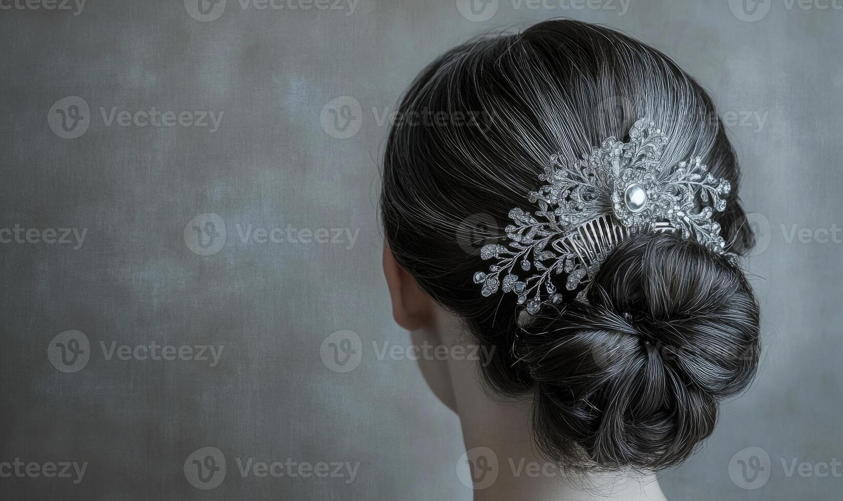 A woman with a black hair style and a silver hair clip photo