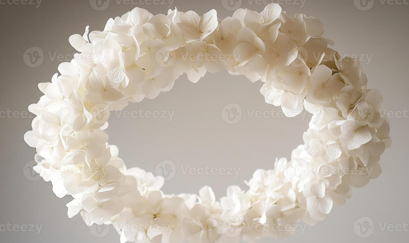 A white flower wreath with a white flower in the center photo