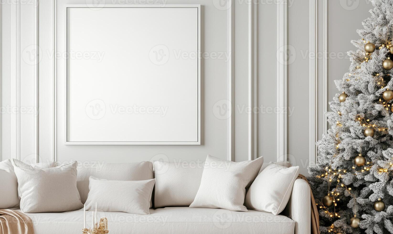 A white couch sits in front of a white wall with a large white picture frame photo