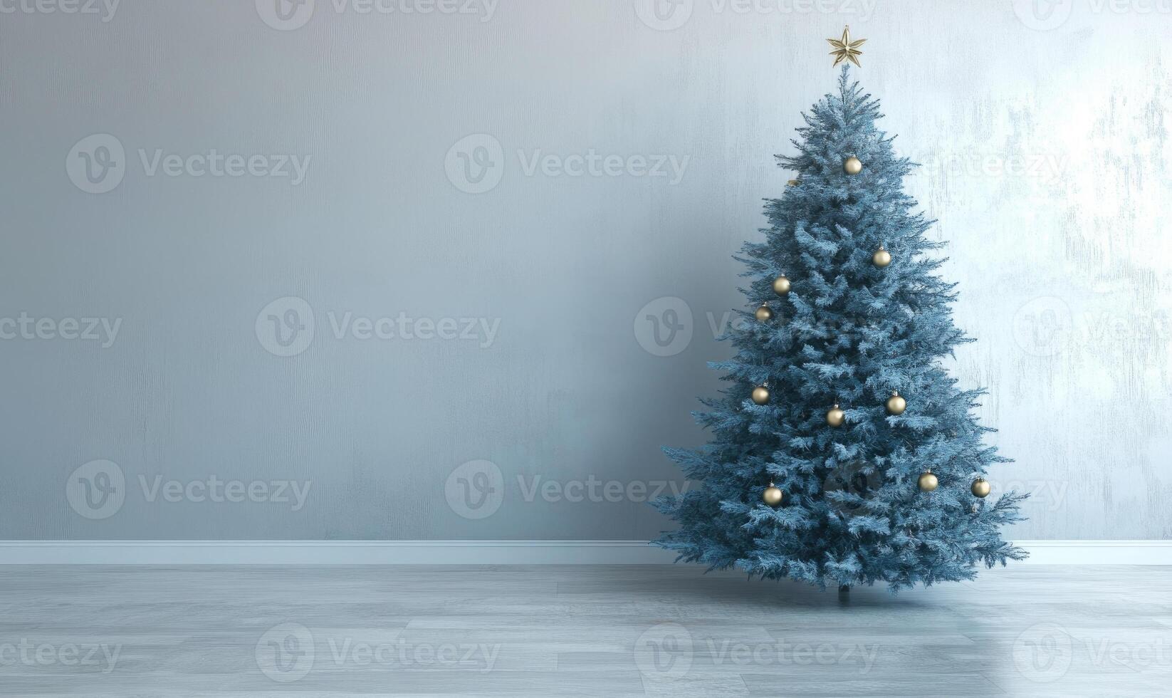 A large blue Christmas tree with gold ornaments sits in a room with a white wall photo