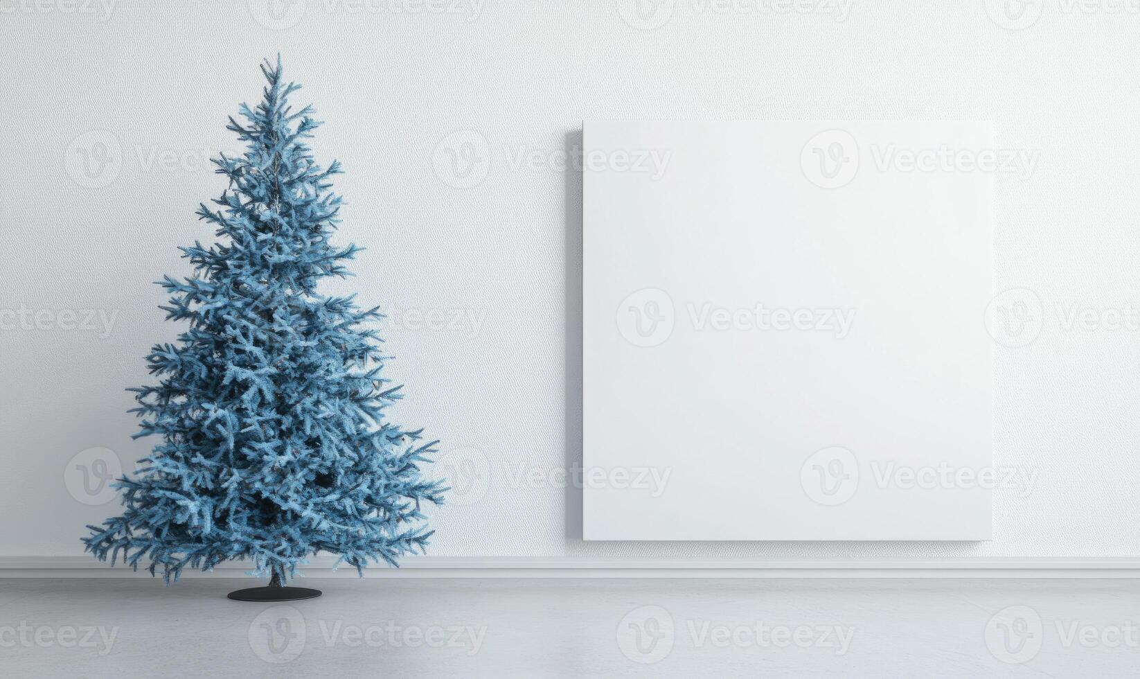A blue Christmas tree stands in front of a white wall photo