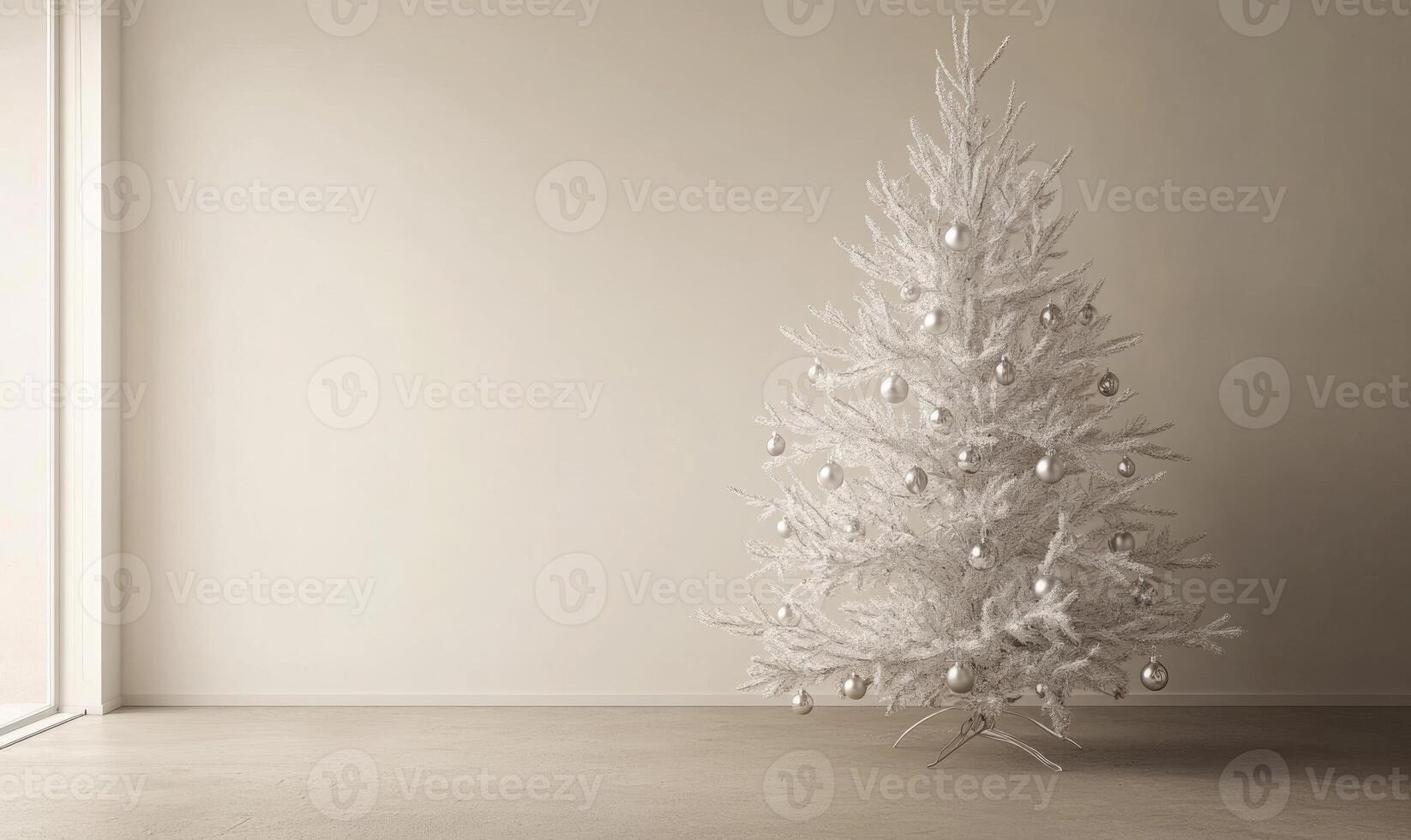 A white Christmas tree stands in a bare room photo