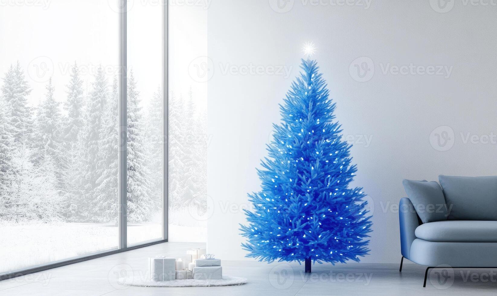 A blue Christmas tree sits in front of a window with snow outside photo