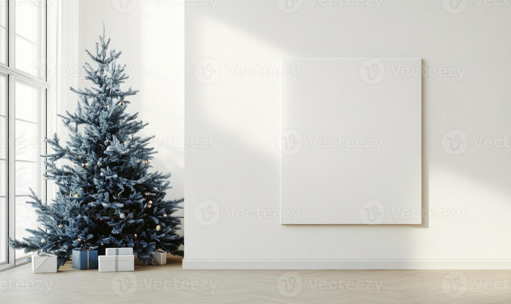 A white wall with a blue Christmas tree in front of it photo