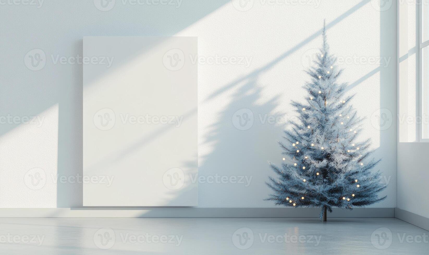 A white room with a large white wall and a small white Christmas tree photo
