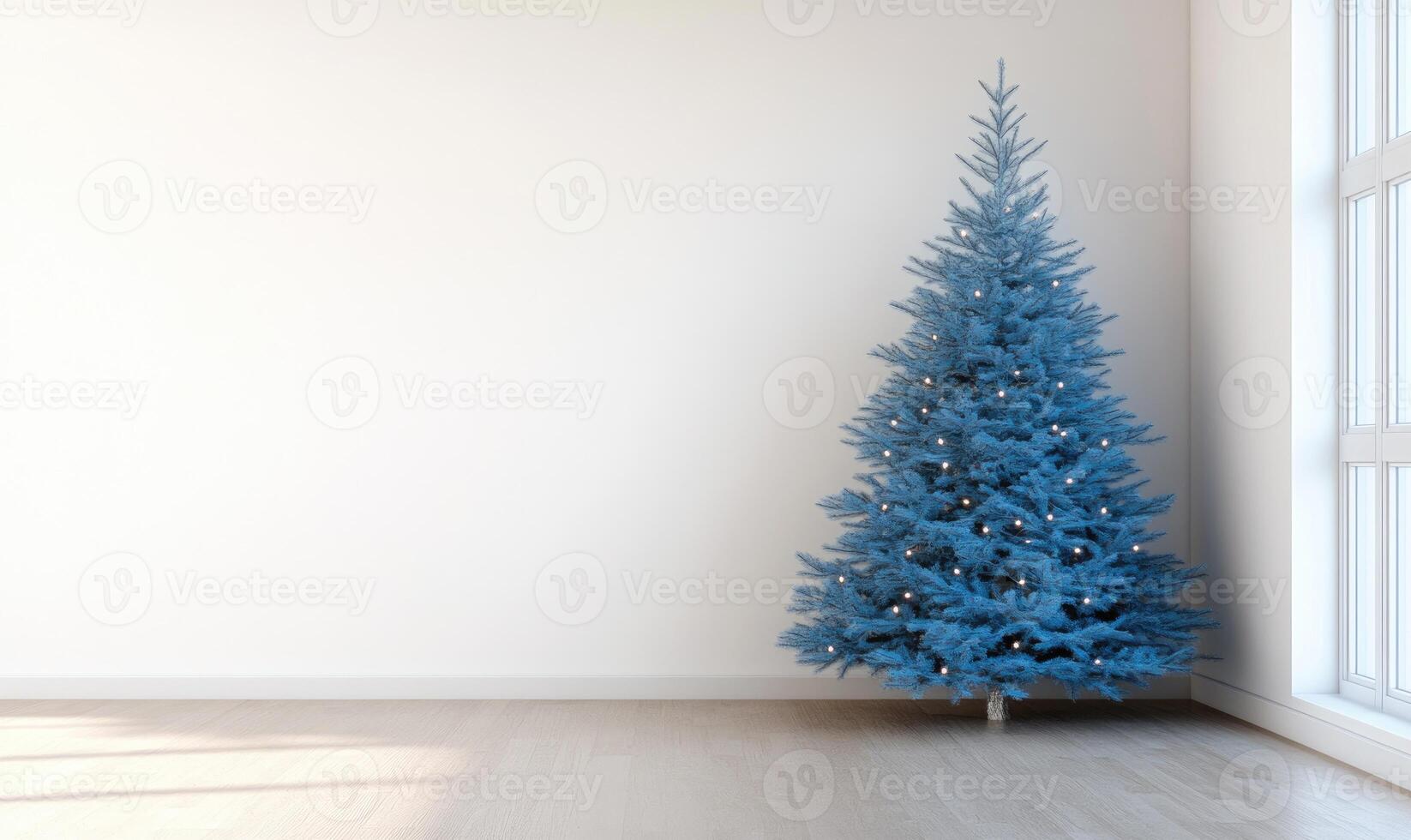 A blue Christmas tree stands in a bare room photo
