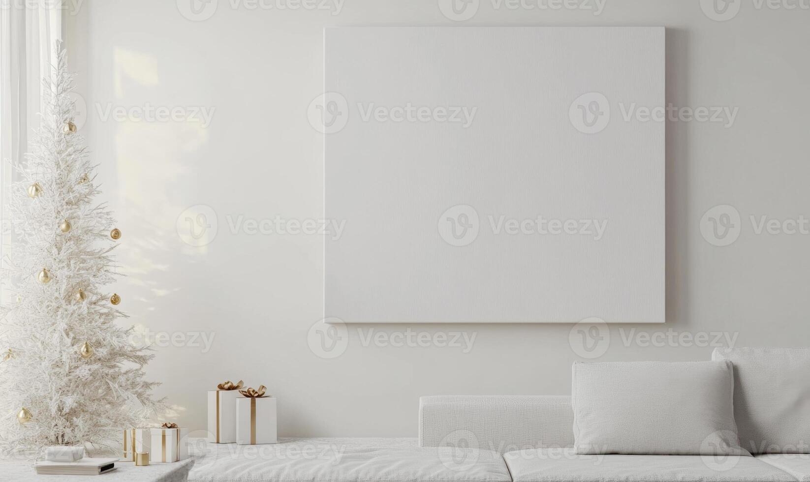 A white Christmas tree sits in front of a white wall with a large blank wall photo