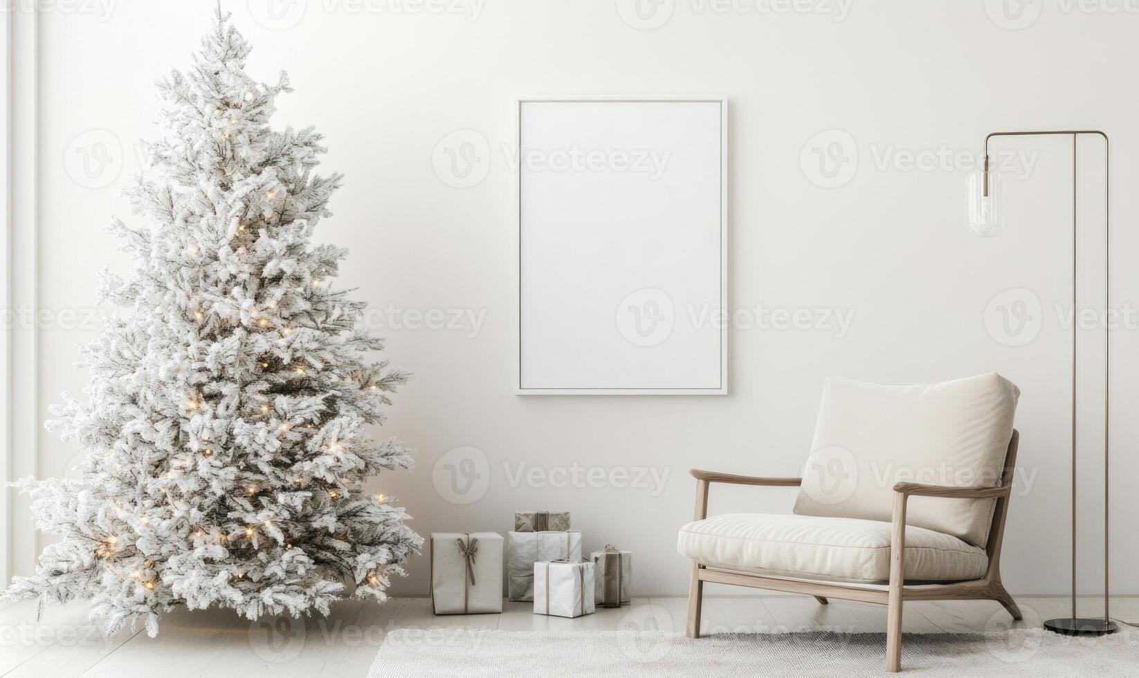 A white Christmas tree is lit up with lights and sits in front of a white wall photo