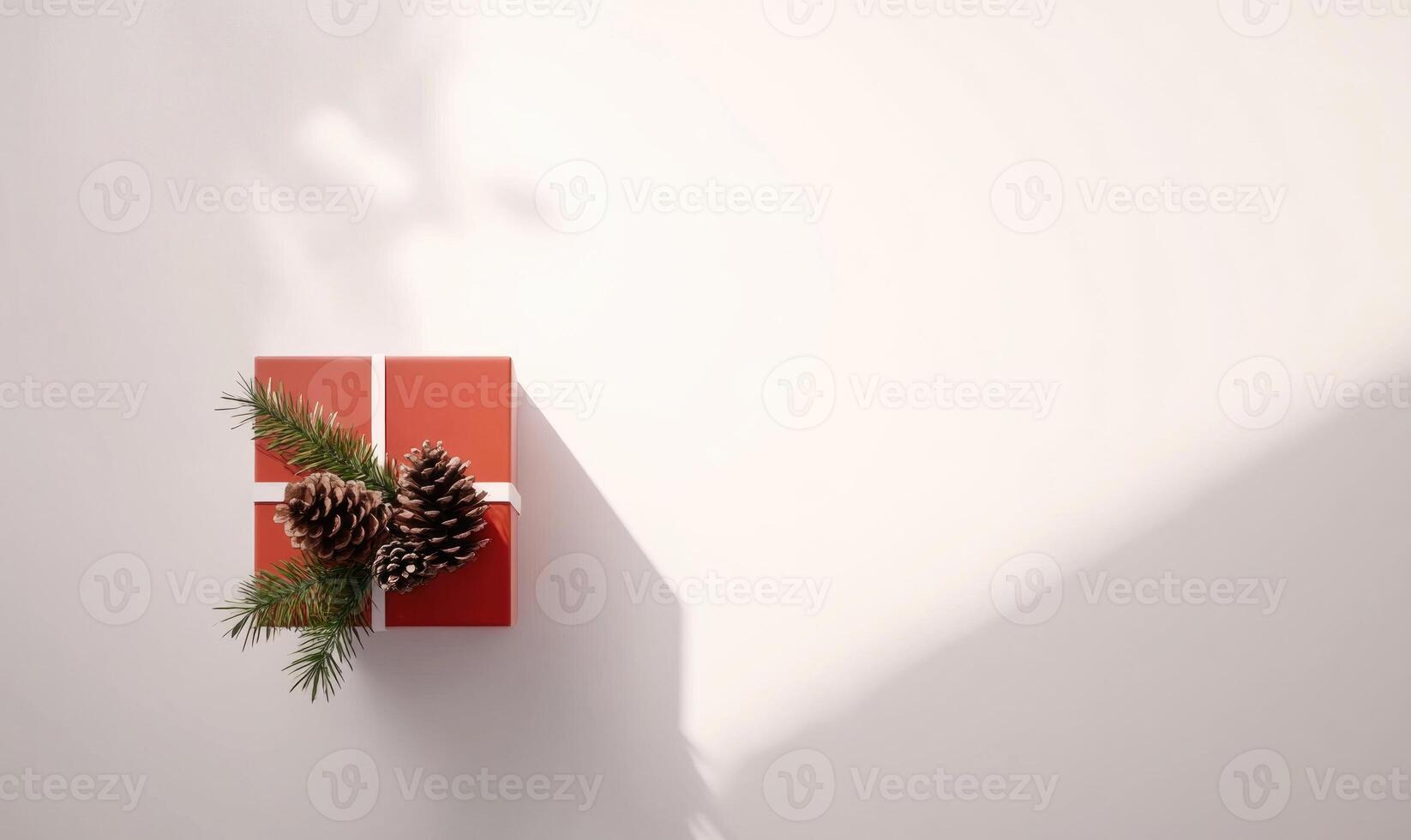 A red box with pine cones on top of it photo