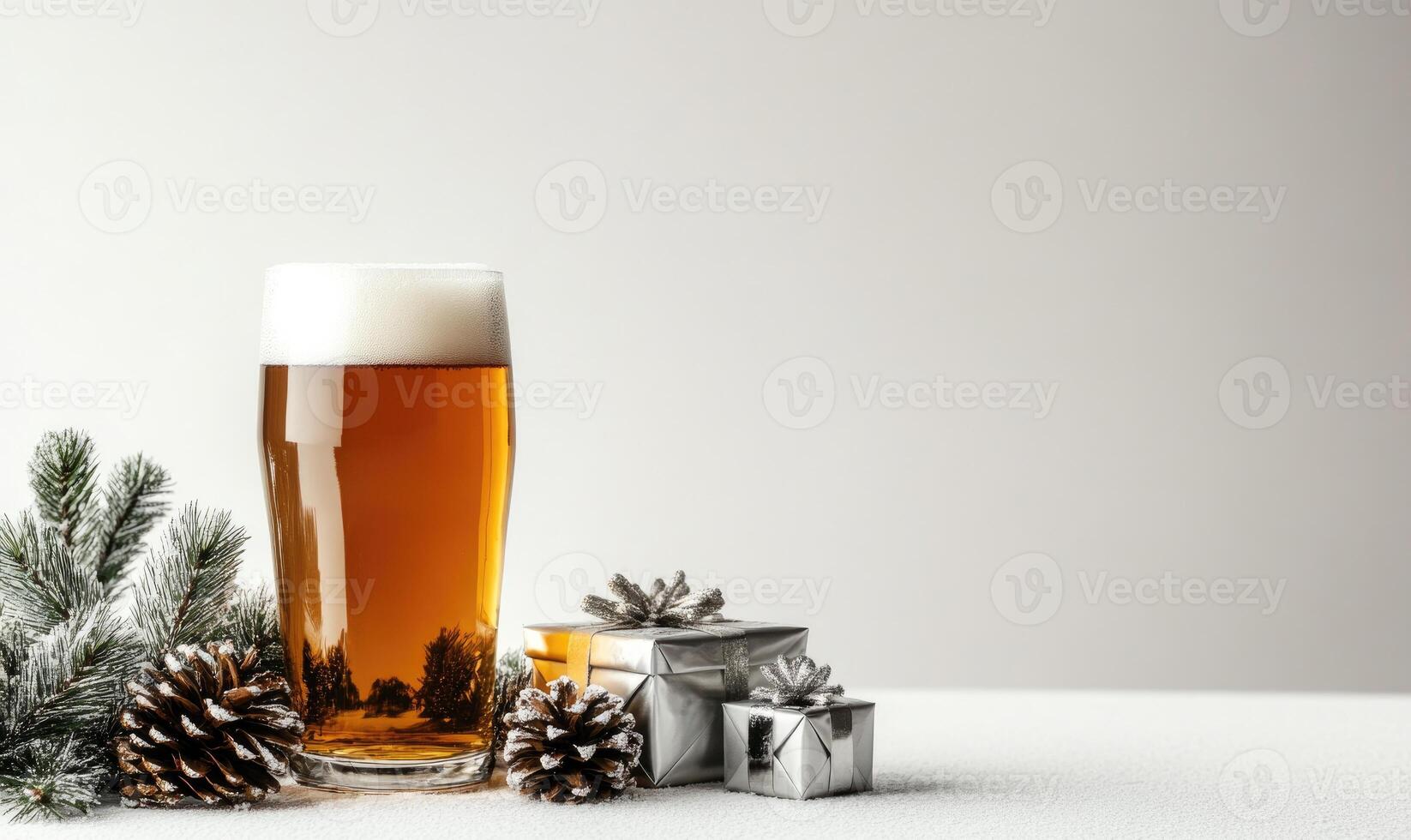 A glass of beer is on a table with pine cones and presents photo