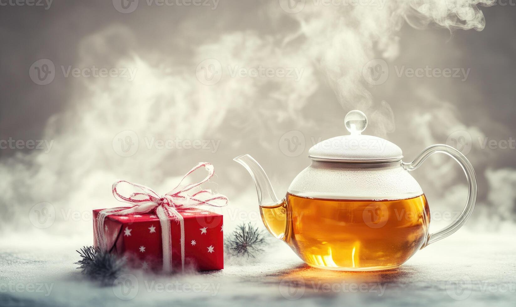 A red box with a bow on it sits next to a teapot photo