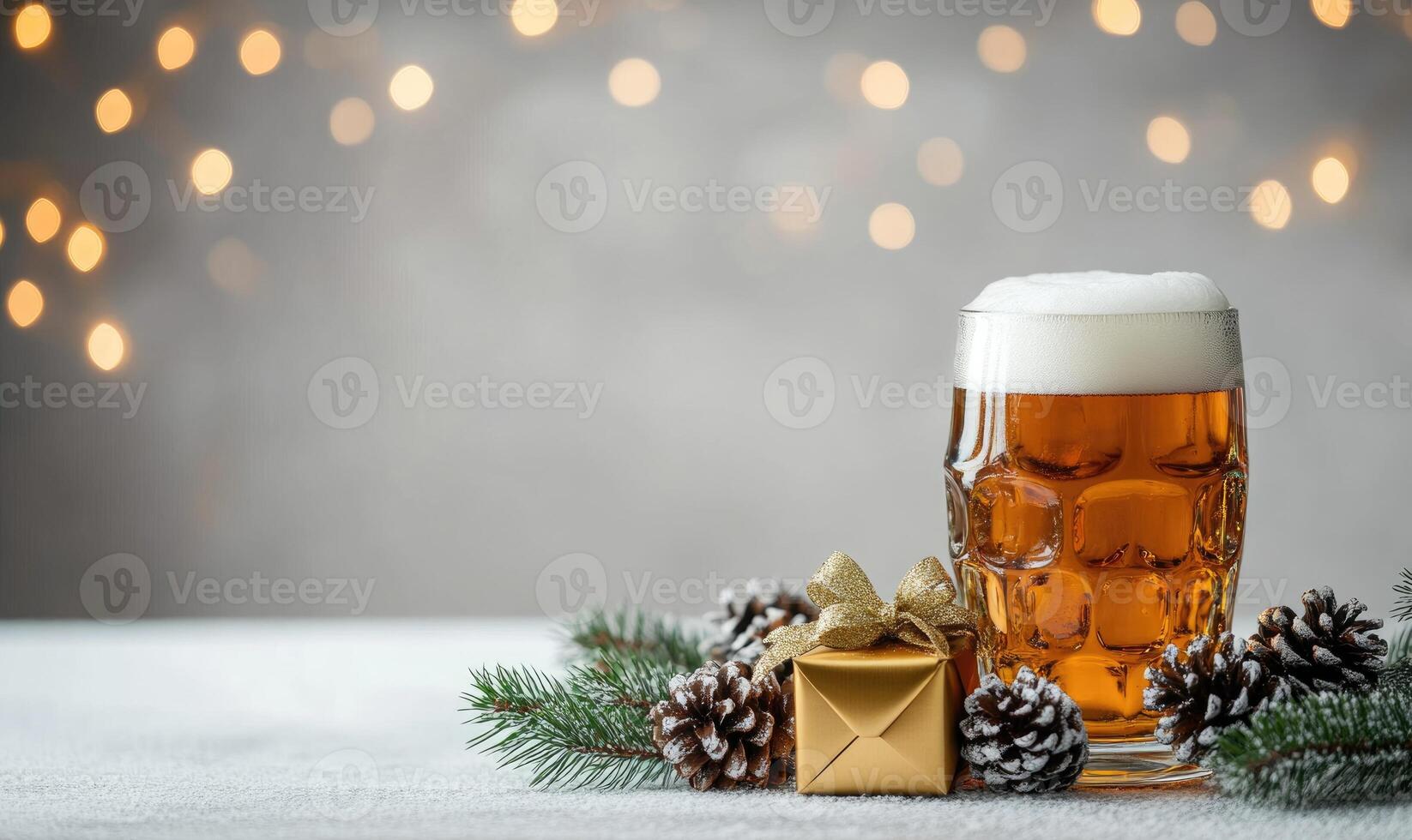 A glass of beer sits on a table next to a gold box photo