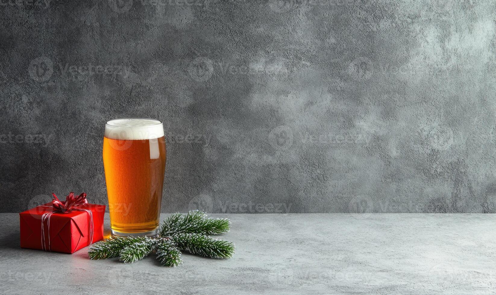 A glass of beer sits on a table next to a red box photo