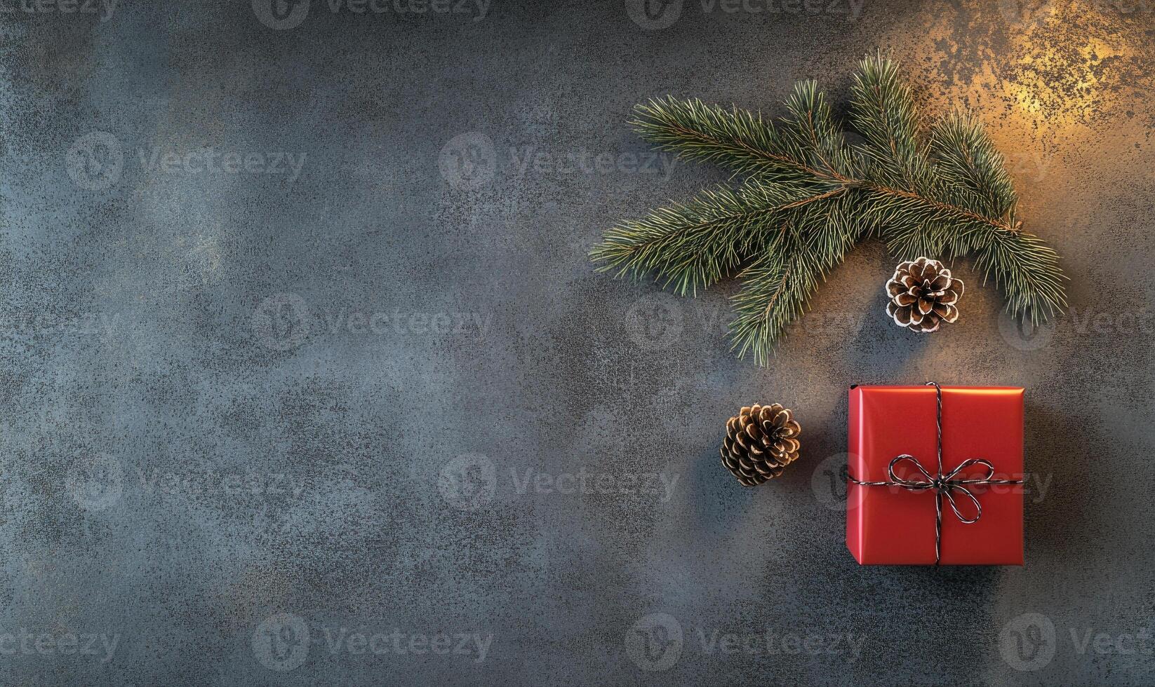 A red box with a ribbon on it sits on a grey background photo