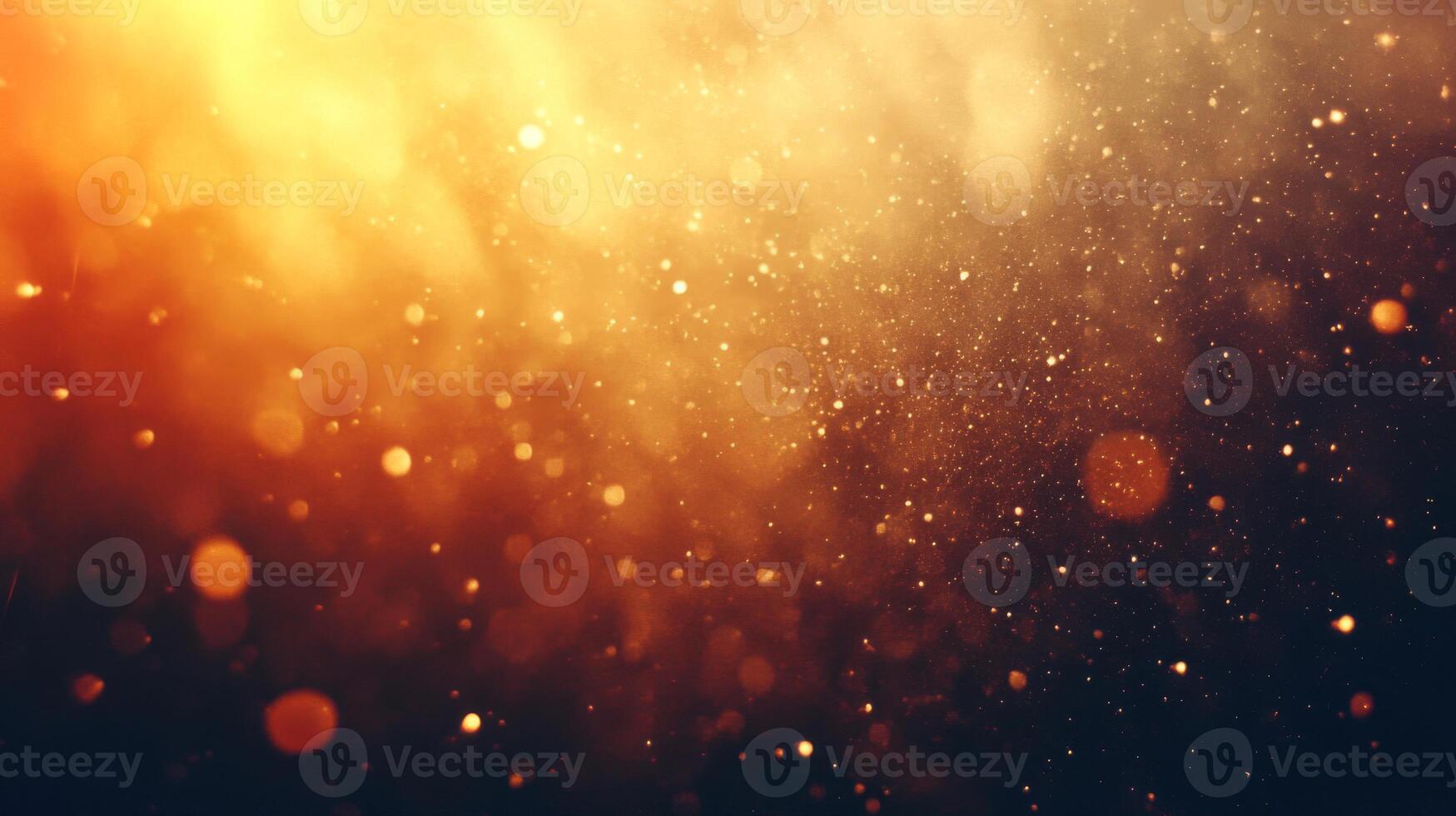 Golden bokeh and light dust particles against a dark background photo