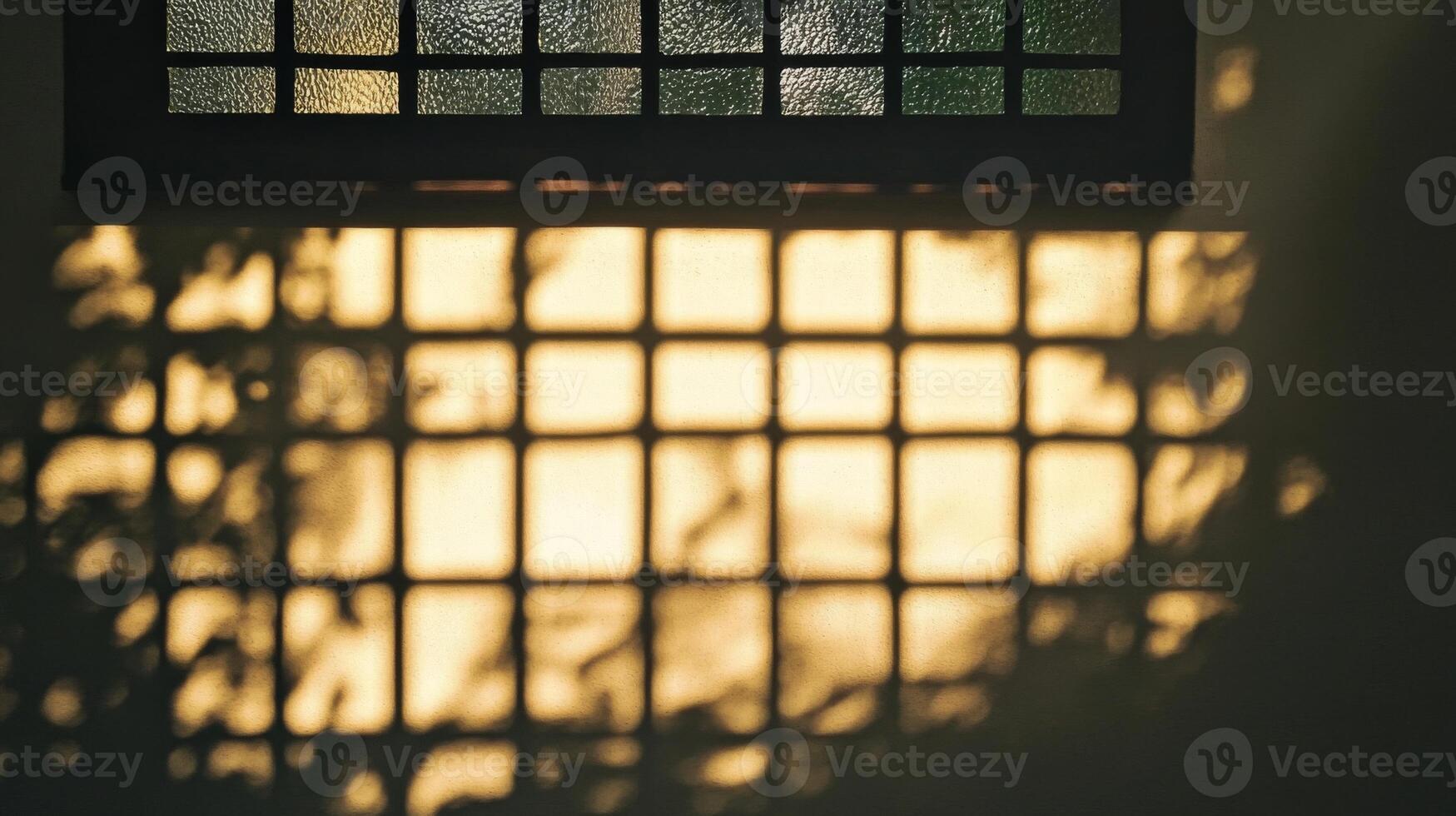 A Gridded Shadow Cast by a Window on a Wall photo