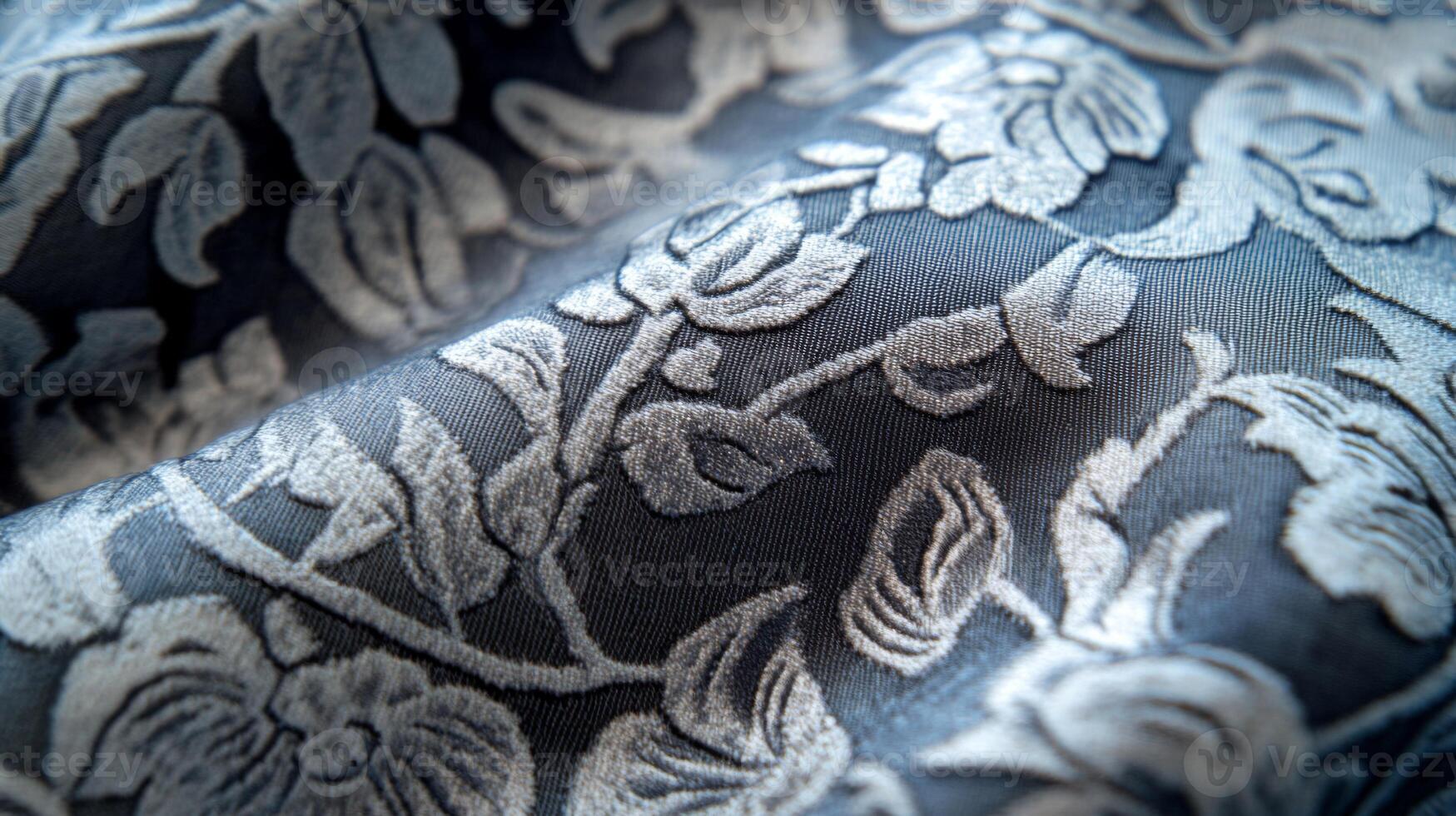 Close-up of a Dark Fabric with Embroidered Floral Design photo