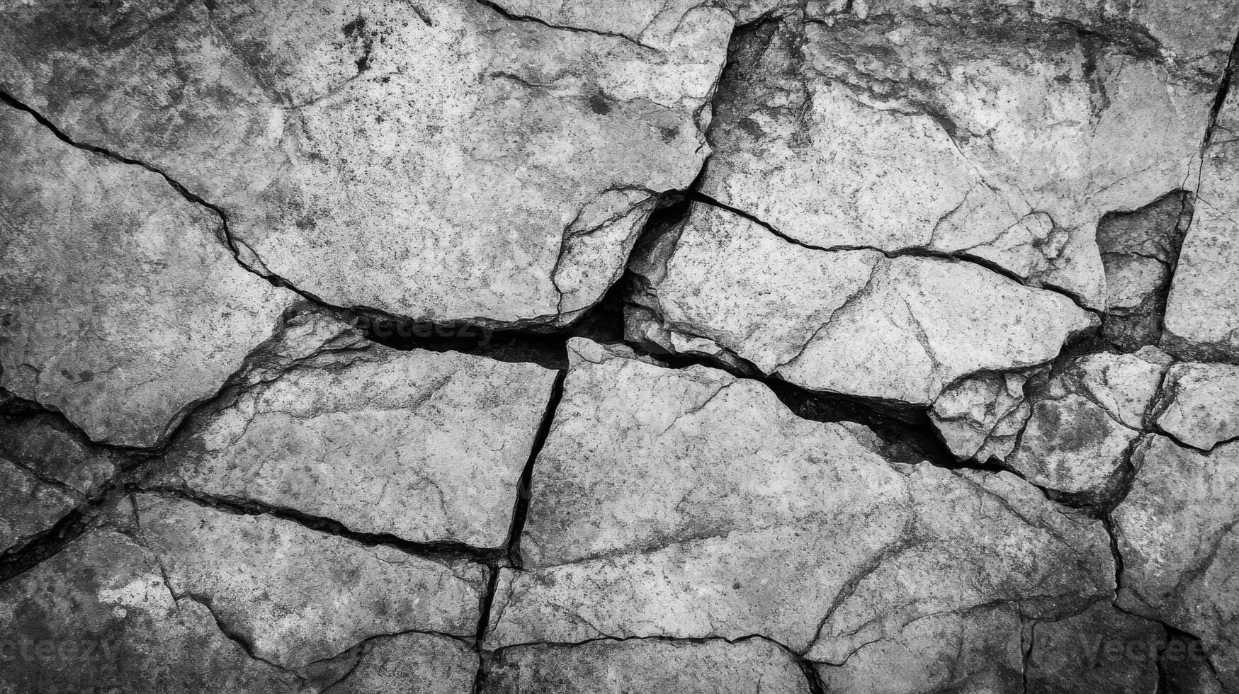 Cracked and Weathered Stone Surface photo