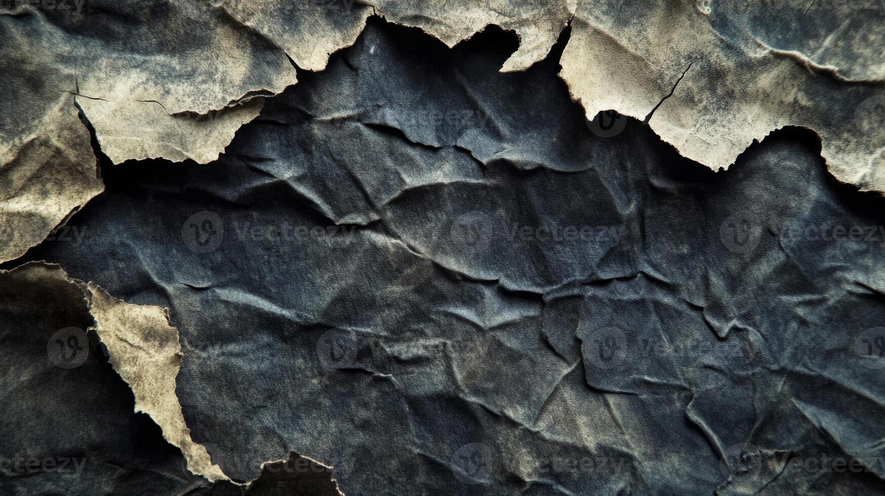 Torn and Wrinkled Dark Paper with Faded Edges photo