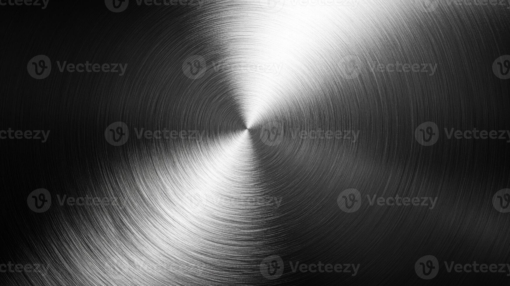 A circular pattern of concentric lines on a metallic surface photo