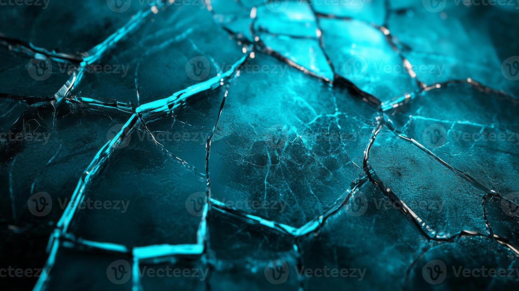 A close-up of cracked blue ice with intricate patterns photo