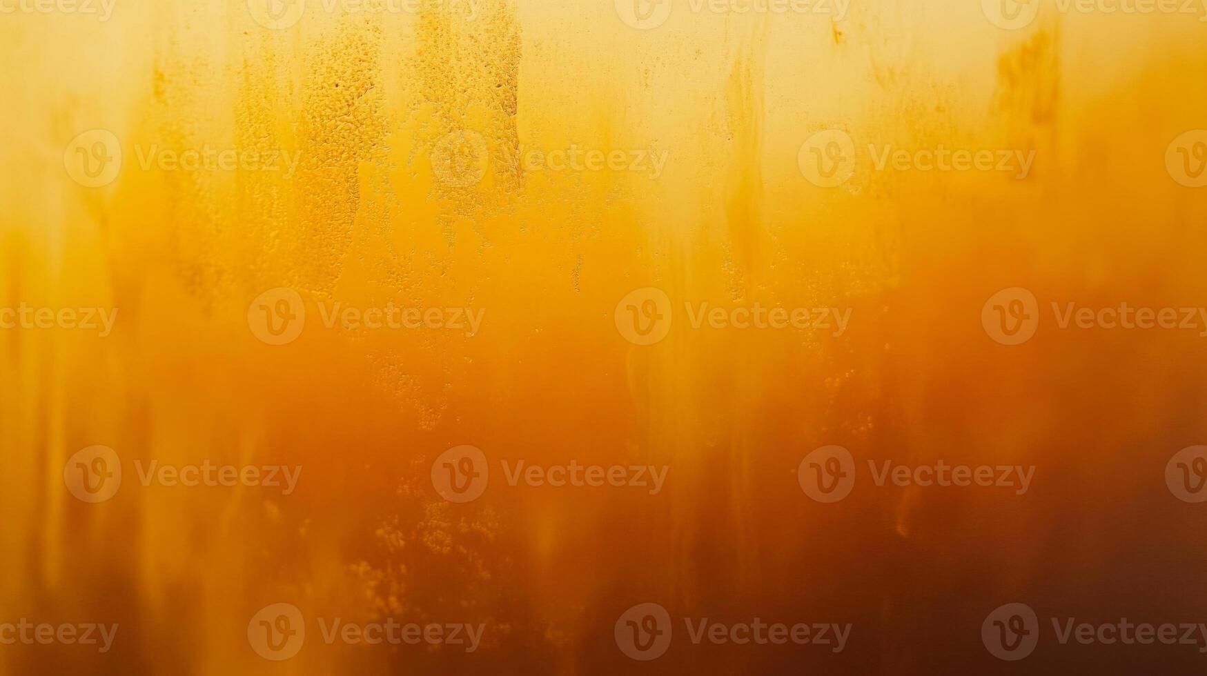 Close-up of Condensed Water on a Glass of Orange Juice photo