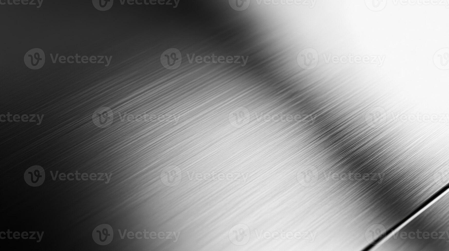 Close-up of a Brushed Metal Surface with Diagonal Lines and a Shadow photo