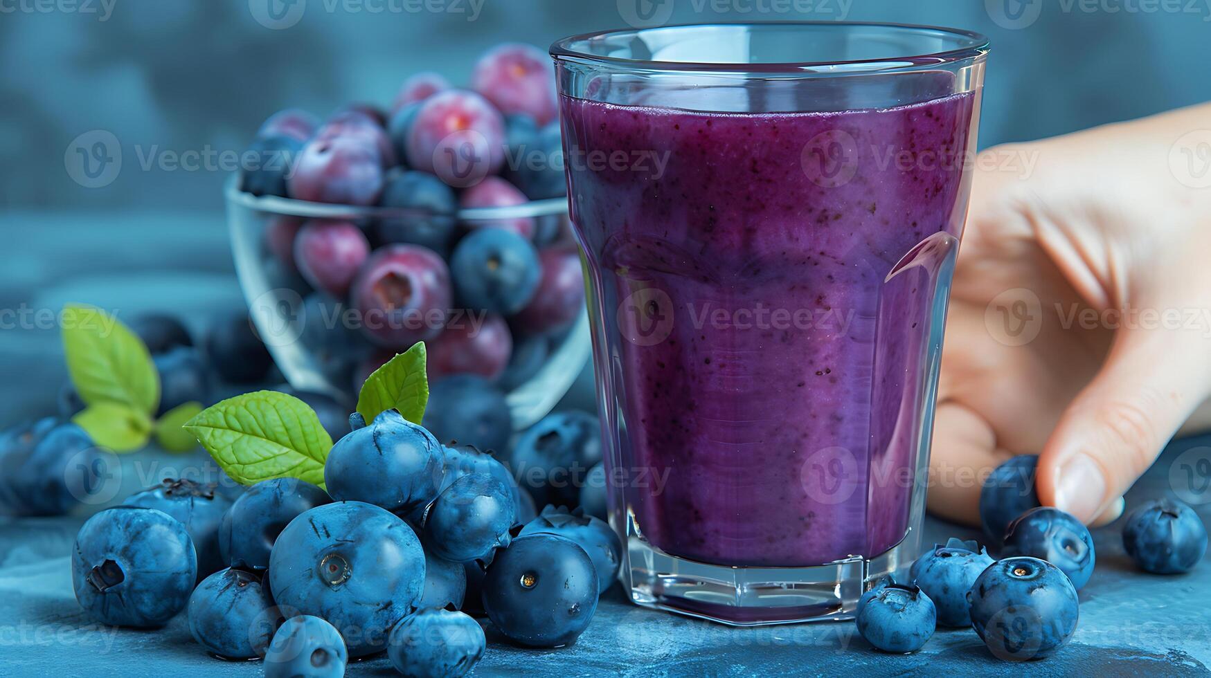 Glass of antioxidantrich blueberry juice with a handful of blueberries cut out on an isolated simple minimalist background photo
