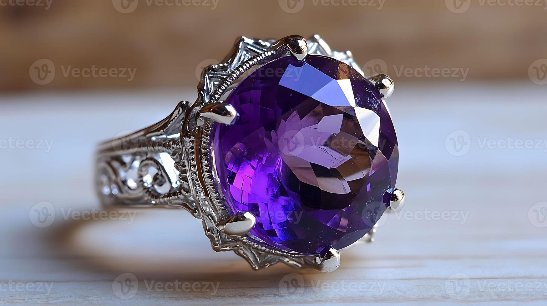 Beautiful amethyst ring featuring a large purple gemstone surrounded by delicate silver filigree evoking a sense of royalty photo
