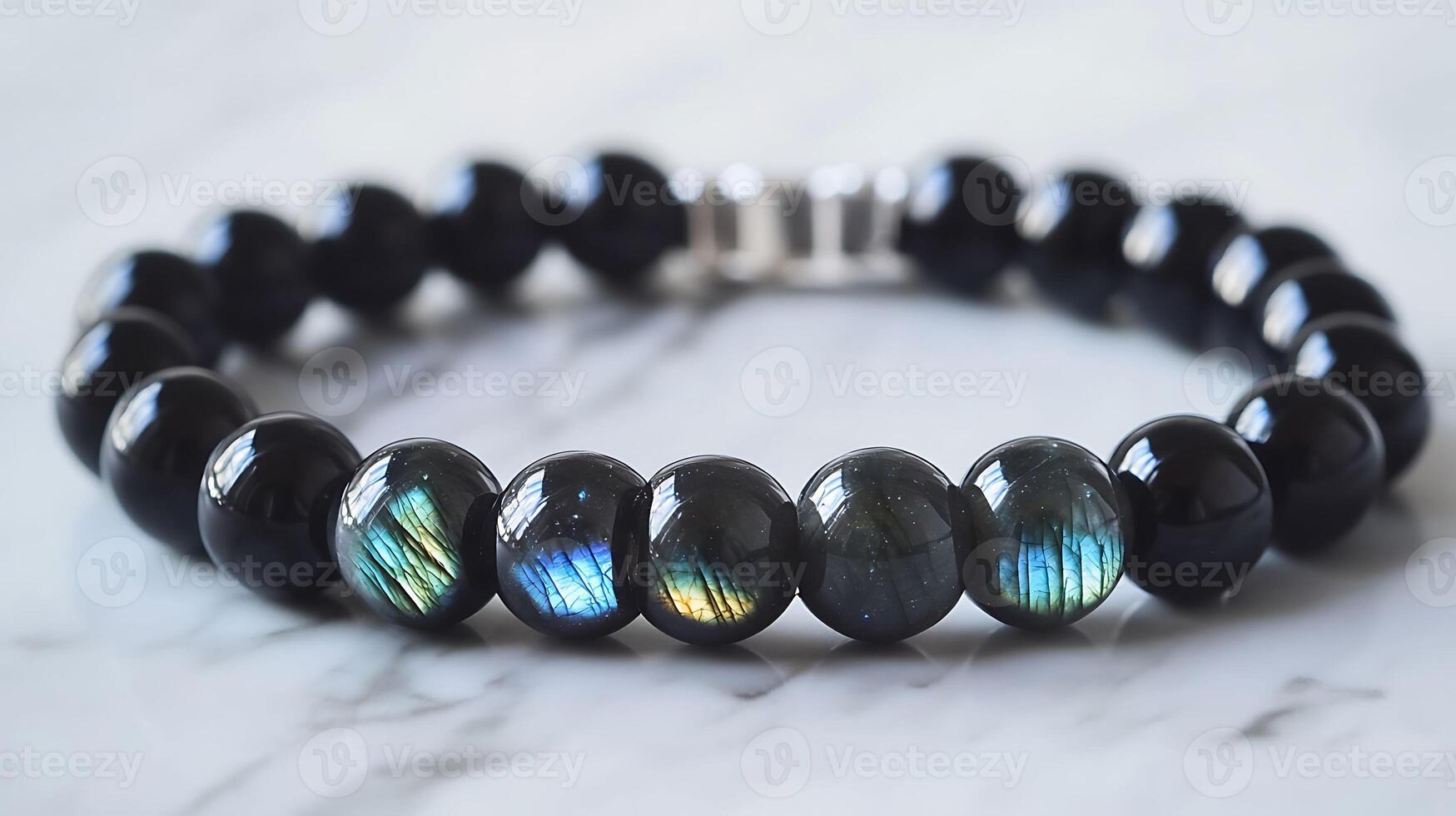 Elegant obsidian and labradorite bracelet with deep black obsidian and shimmering bluegreen labradorite stones in a sleek design photo