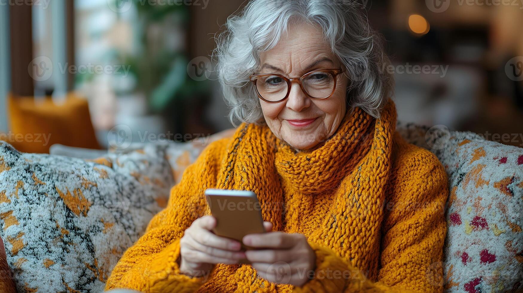 Cheerful senior woman seated on a sofa, using her smartphone to read a message. The bright, comfortable living room enhances the joyful atmosphere. photo