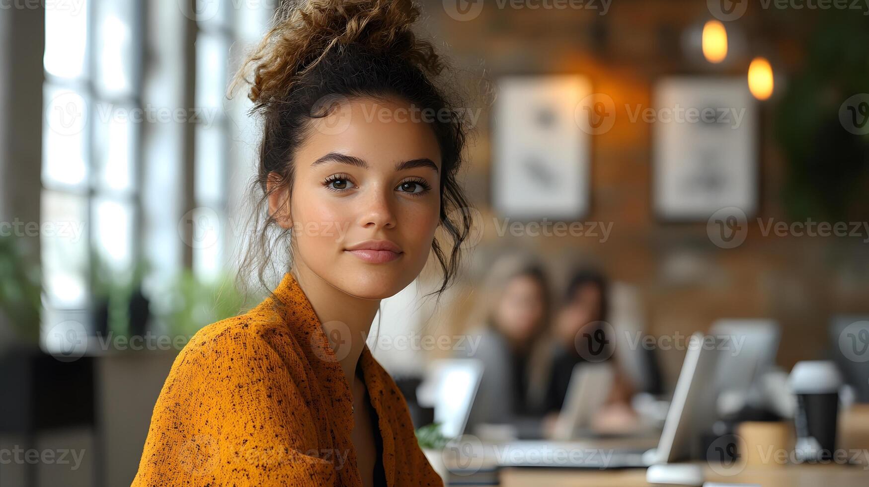 Female entrepreneur leading a marketing strategy session with her team, confidently presenting in a bright, modern workspace photo