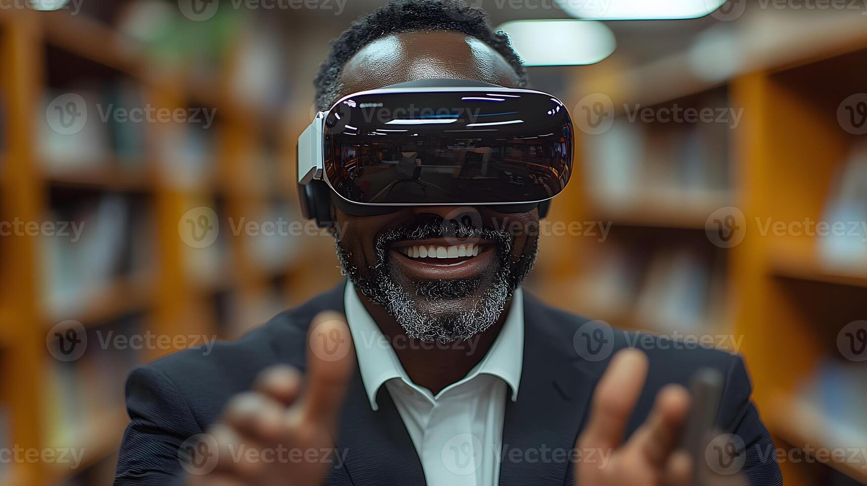 Office setting with a businessman wearing VR goggles, smiling and gesturing with excitement as he engages with a virtual reality experience. photo