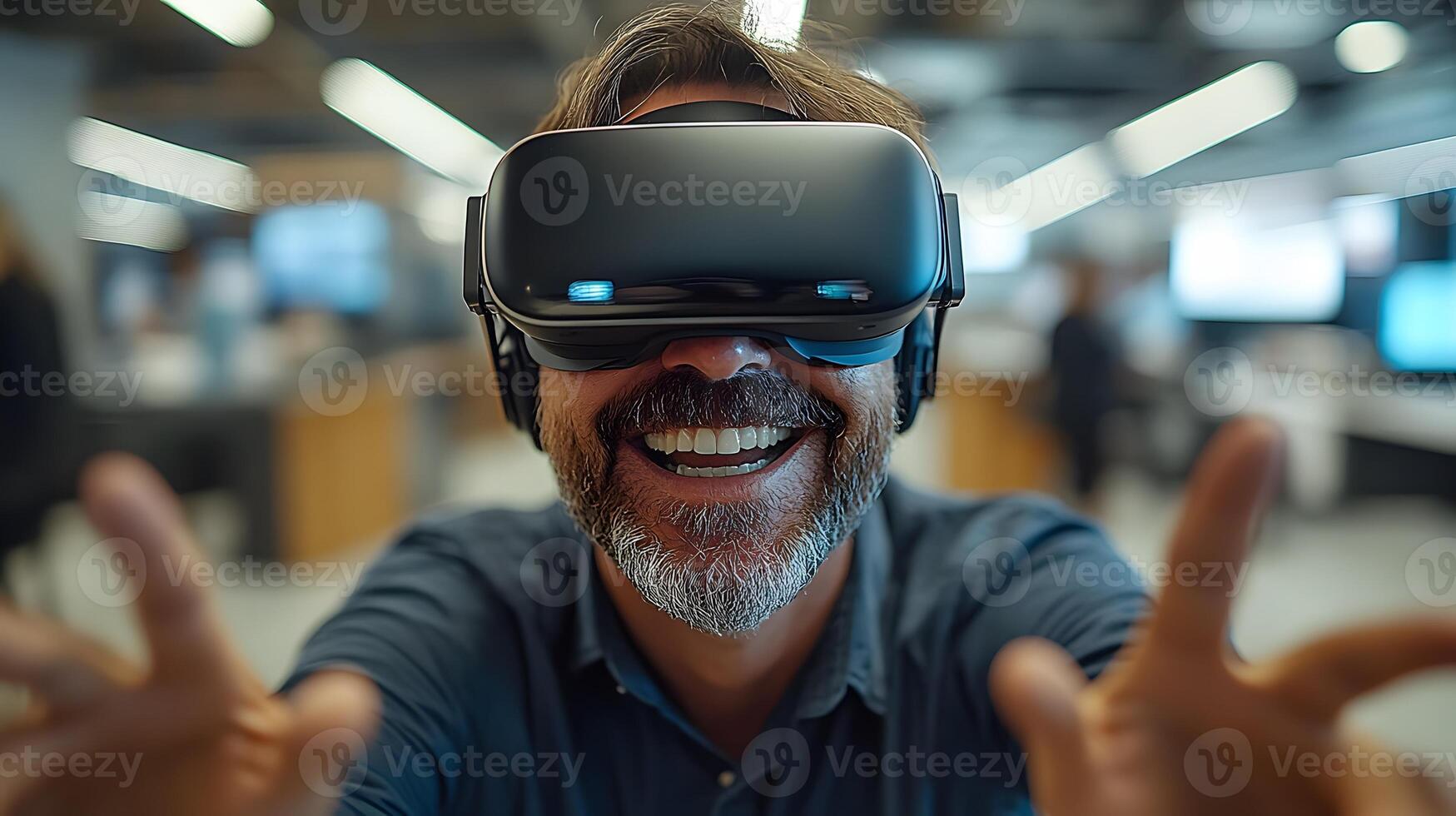 Office setting with a businessman wearing VR goggles, smiling and gesturing with excitement as he engages with a virtual reality experience. photo