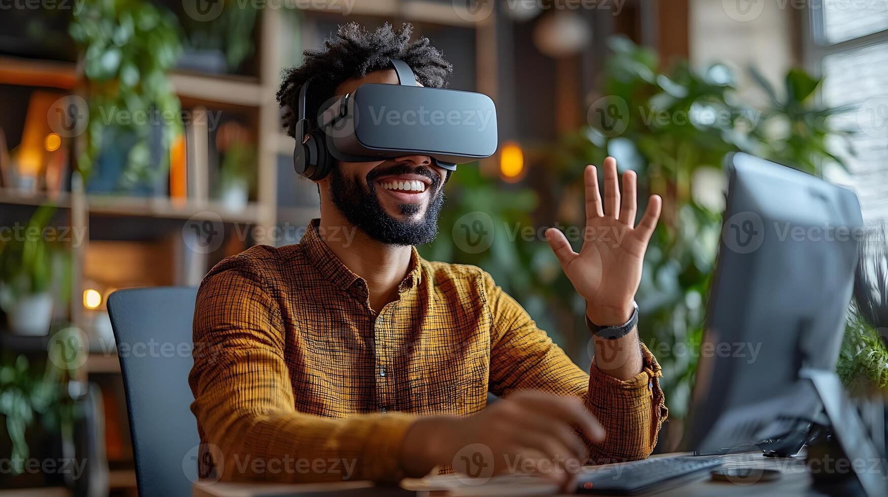 A businessman with a cheerful expression wearing virtual reality goggles, sitting at his desk in a modern office, making creative hand gestures. photo