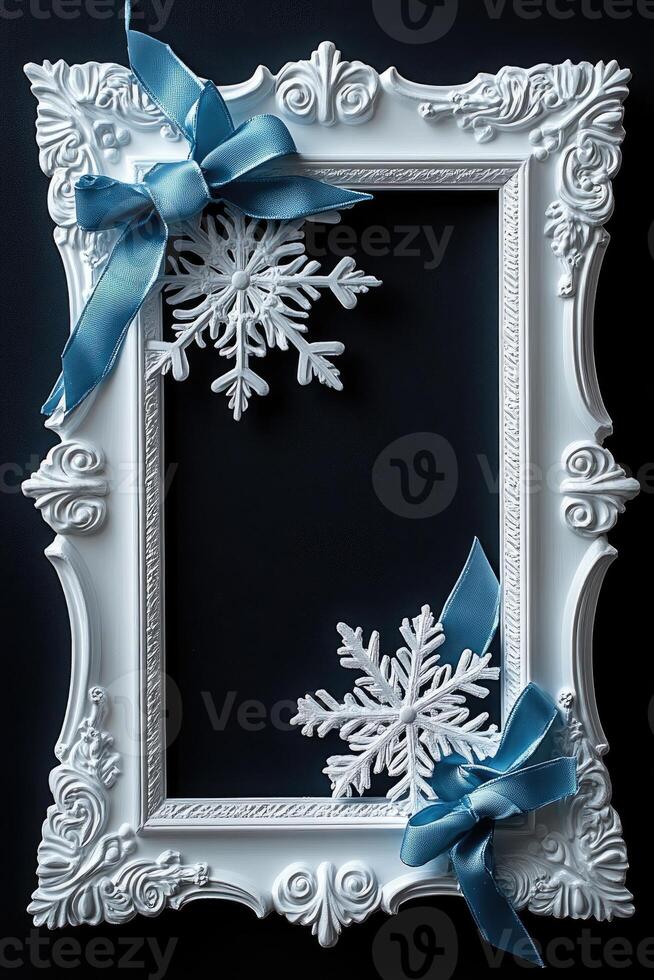 Elegant white christmas frame with blue ribbon and snowflakes decoration on dark background photo
