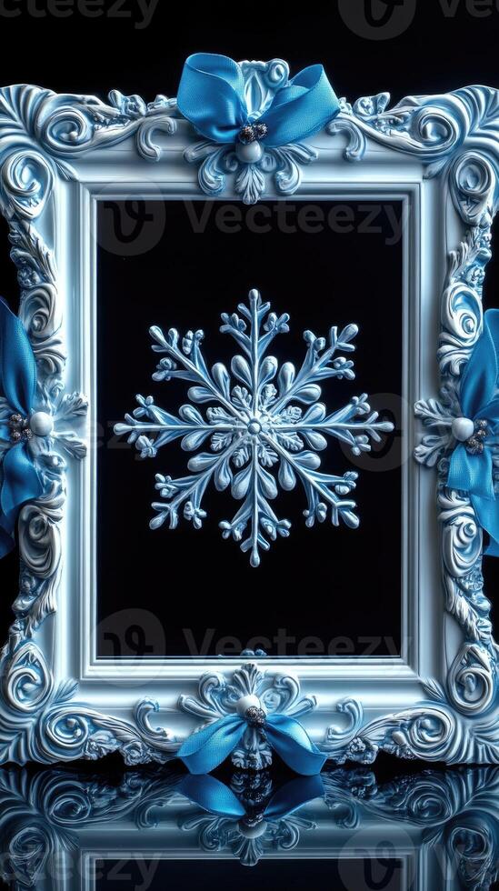 White ornate picture frame decorated with blue ribbons and snowflakes for christmas photo