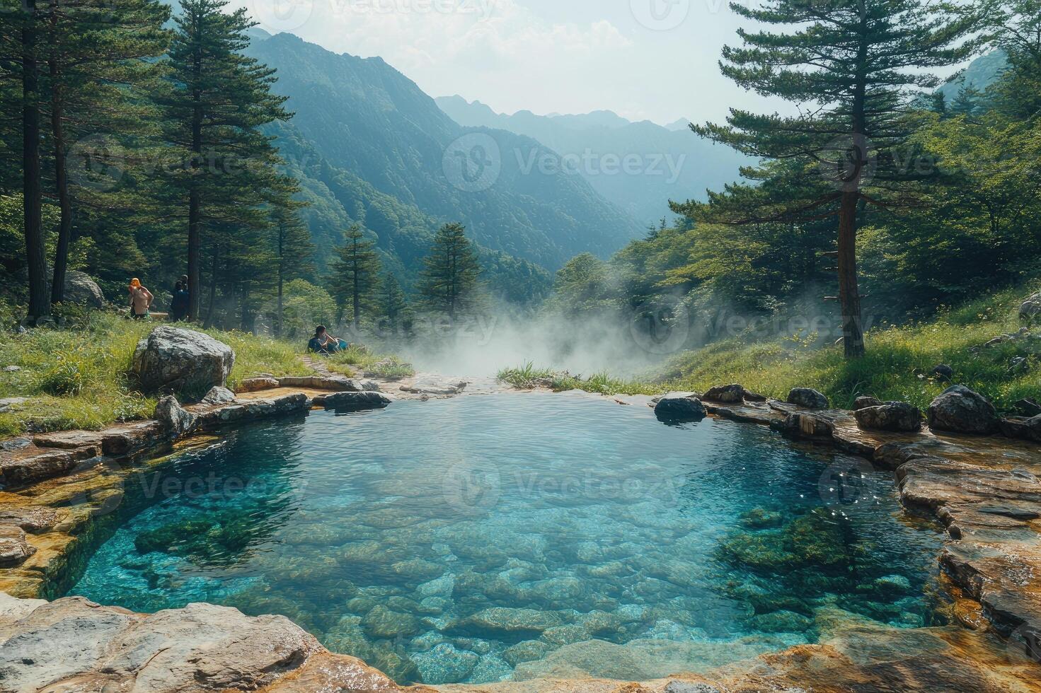 Natural pool reflecting fog surrounded by forest and mountains photo