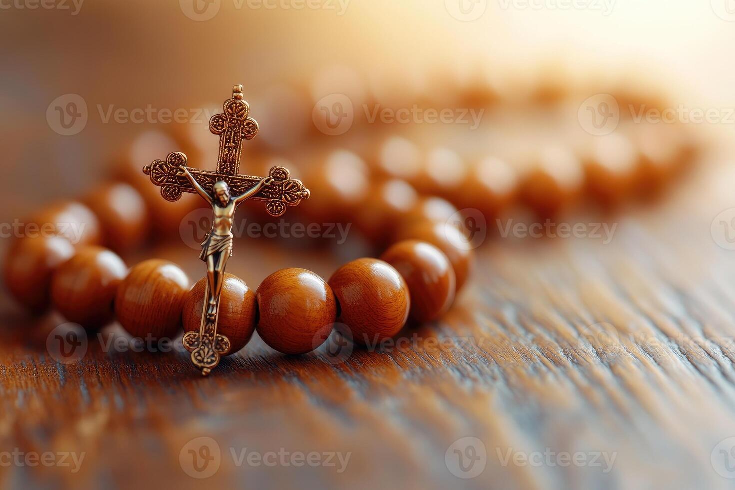 Wooden rosary beads with crucifix resting on rustic tabletop photo