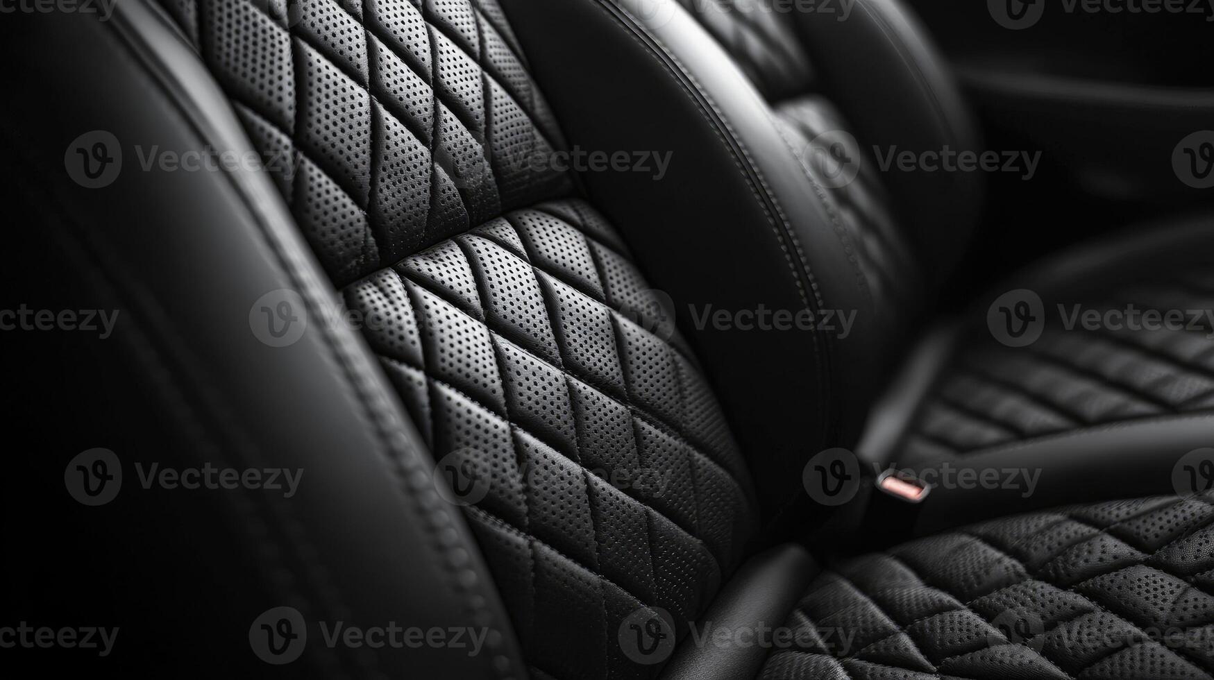 Empty black leather car seat with a diamond pattern stitching photo