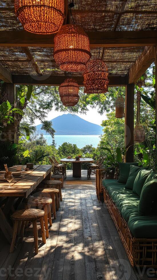 Relaxing terrace overlooking lush green valley and volcano photo