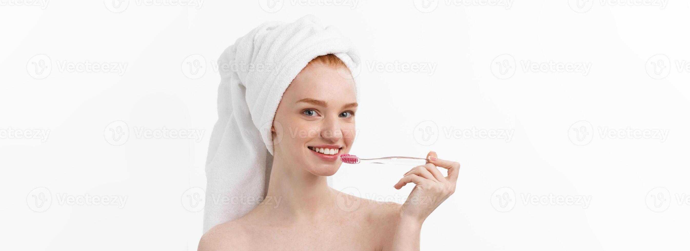 Portrait of young woman with toothbrush on grey background. photo