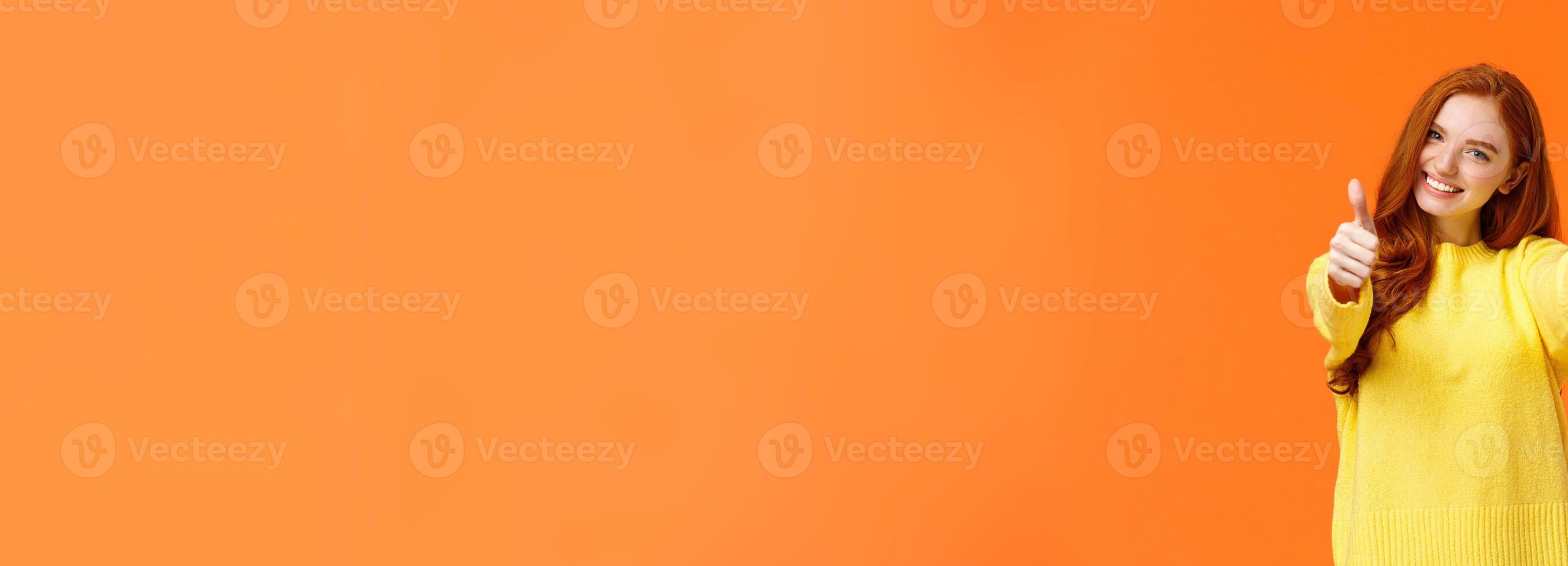 Good luck. Optimistic, confident cute redhead girlfriend encourage you, giving thumbs-up in like or approval, smiling rate excellent movie or product, give positive feedback, recomment, orange wall photo