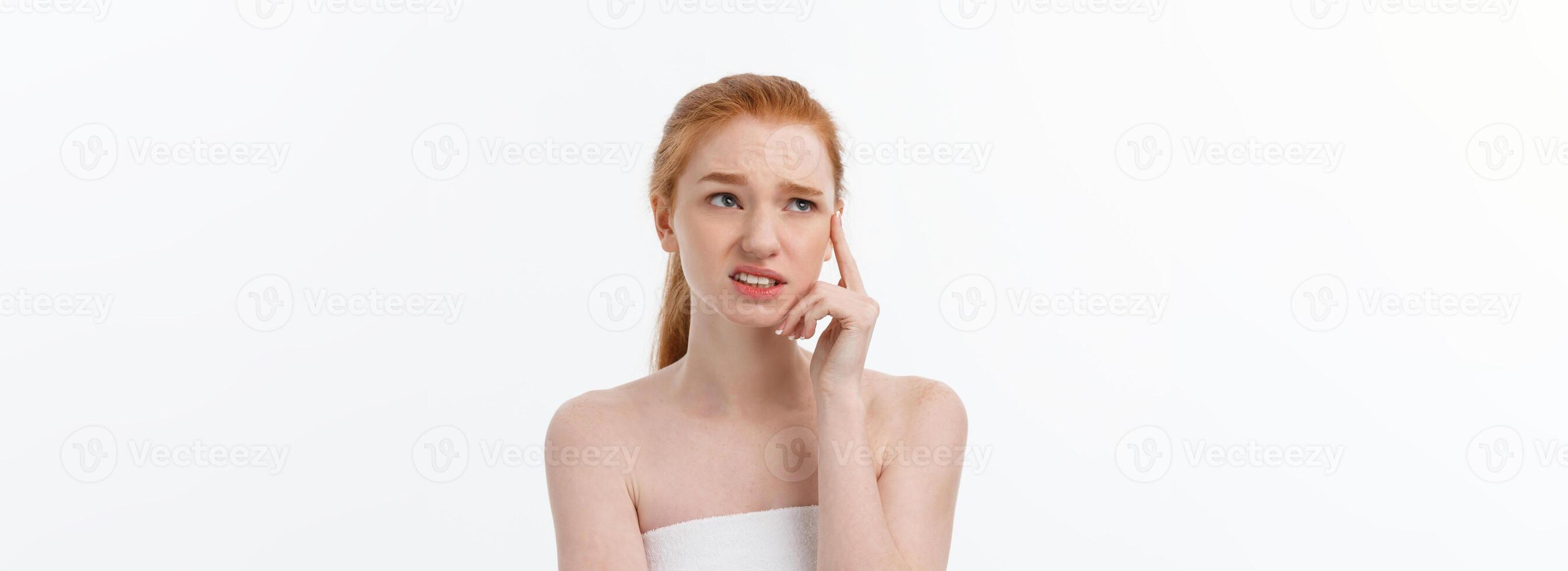 Portrait sad serious young woman with disappointed facial expression.. isolated on white background, looking at camera photo