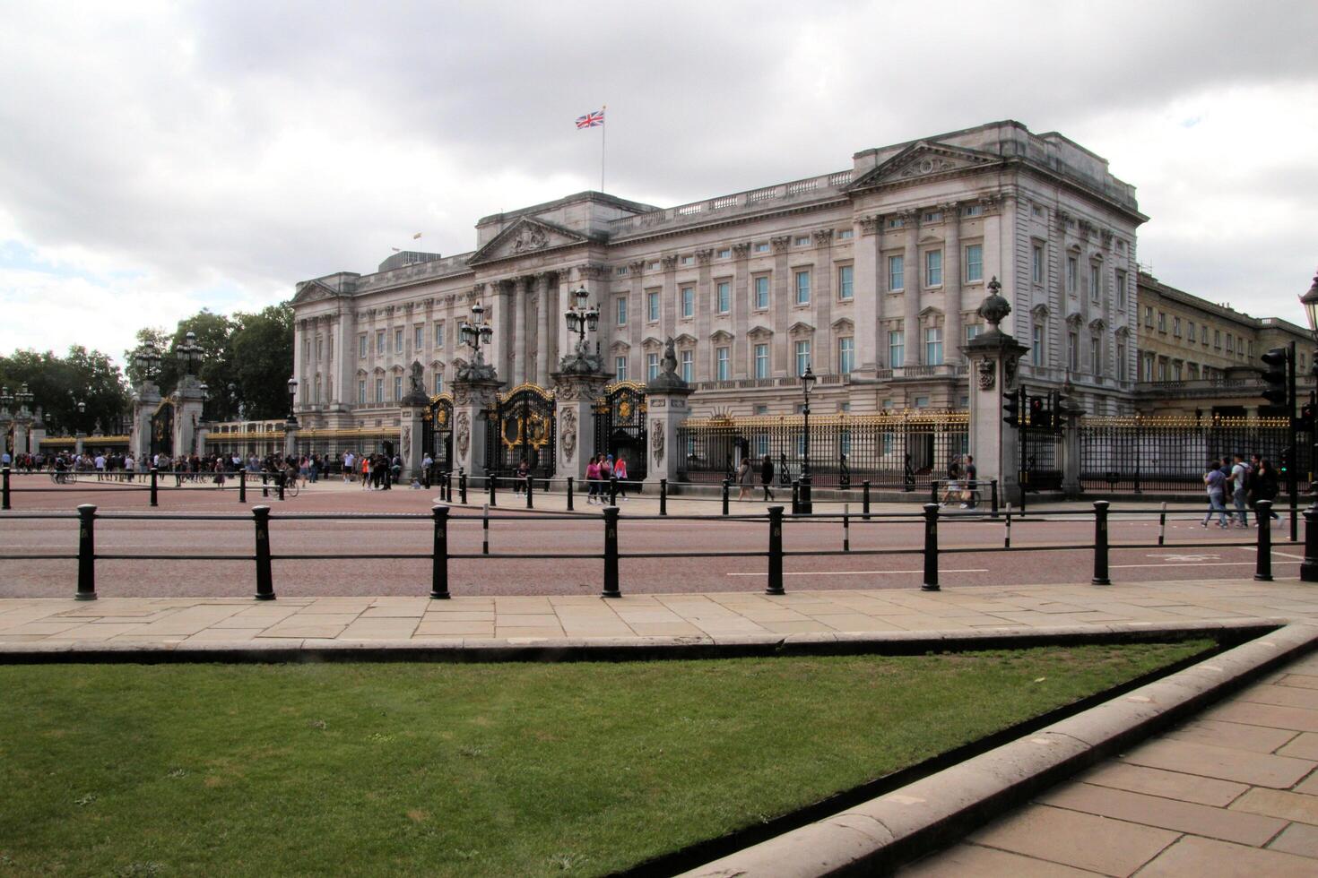 A view of Buckingham Palace in London in August 2023 showing tourists visiting photo