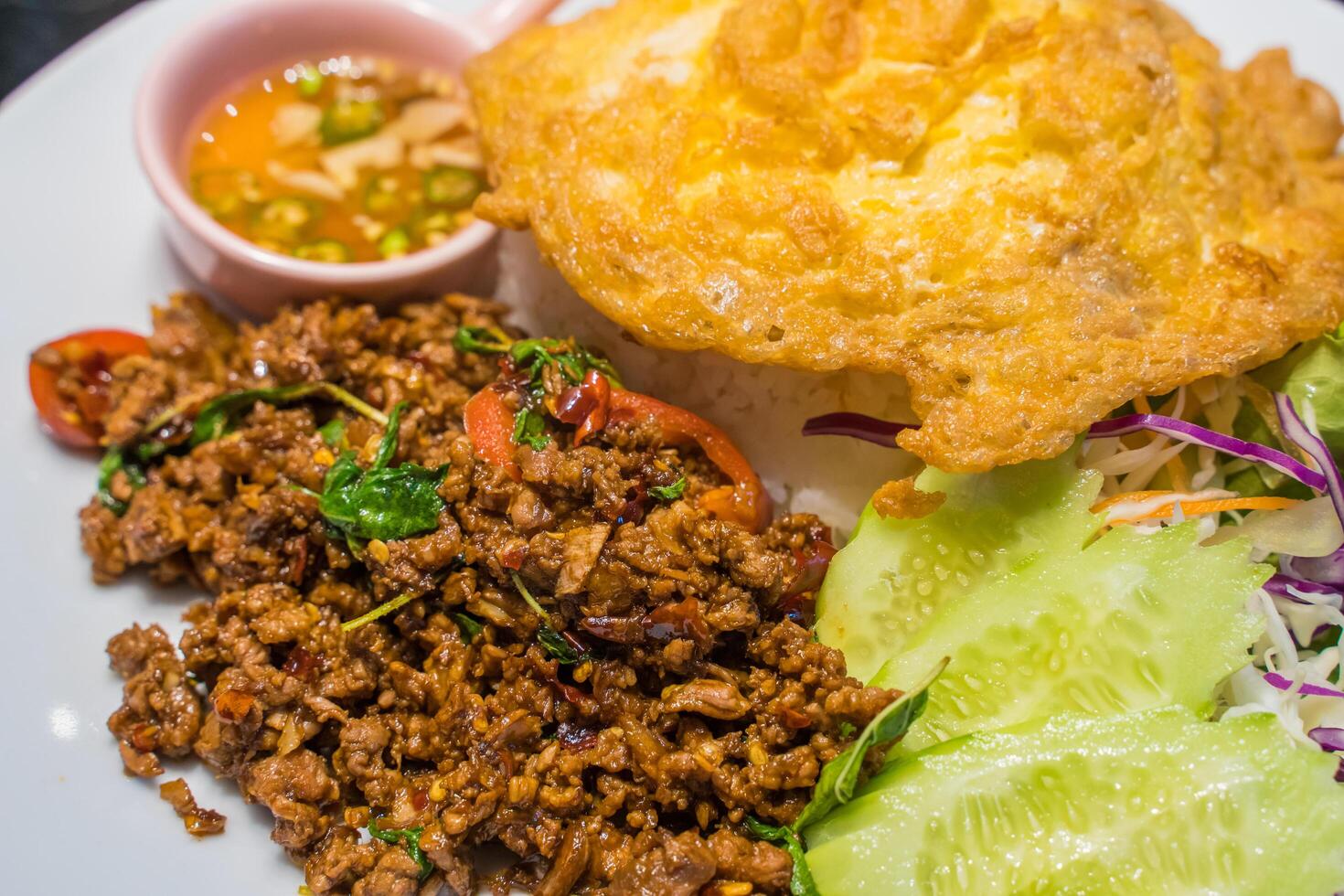 Stir Fried Beef with Holy Basil and Thai omelet.popula thailand streedfood photo