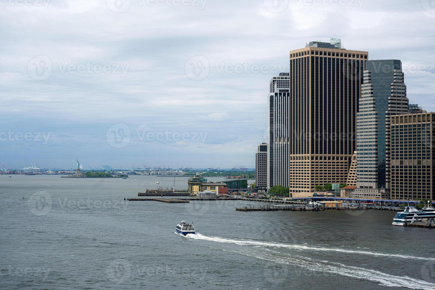 View from the Brooklyn Bridge towards the Statue of Liberty. photo